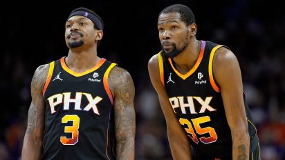 Associated Press - Phoenix Suns guard Bradley Beal (3) and forward Kevin Durant watch a free throw during the second half of Game 3 of an NBA basketball first-round playoff series against the Minnesota Timberwolves, Friday, April 26, 2024, in Phoenix. (AP Photo/Matt York)