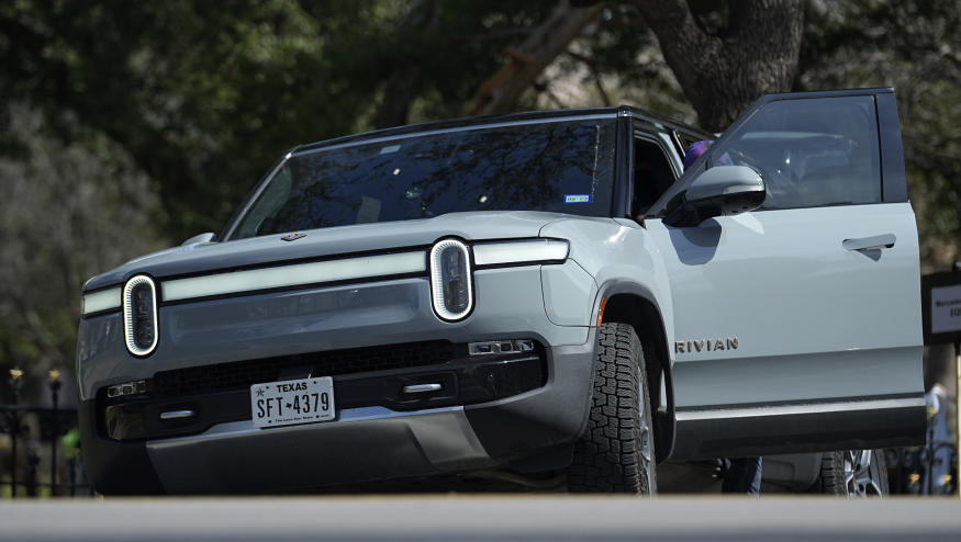 FILE - A Rivian sport-utility vehicle is seen on display in Austin, Texas, Feb. 22, 2023. Rivian reports results on Wednesday, Feb. 21, 2024. (AP Photo/Eric Gay, File)