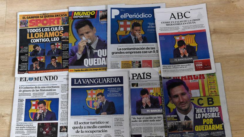 A picture taken in Madrid on August 9, 2021 shows the front pages of Spanish newspapers showing Barcelona's Argentinian forward Lionel Messi crying during a press conference in Barcelona the day before. - Messi is expected to head to the French capital, lured by the limitless funds of Paris Saint-Germain, having said a tearful farewell to Barcelona after 21 years. (Photo by PIERRE-PHILIPPE MARCOU / AFP) (Photo by PIERRE-PHILIPPE MARCOU/AFP via Getty Images)