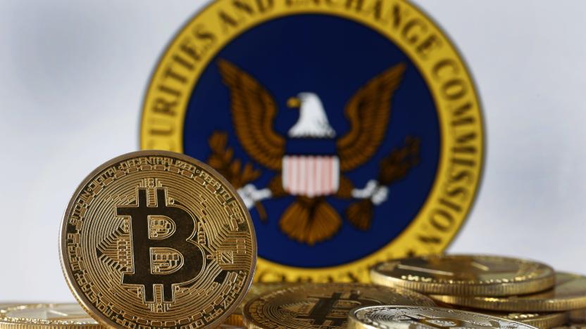 PARIS, FRANCE - JANUARY 10: In this photo illustration, a visual representation of the digital cryptocurrency Bitcoin is displayed in front of Securities and Exchange Commission (SEC) logo on January 10, 2024 in Paris, France. The first American Bitcoin ETF could be authorized by the SEC (Commissioner of the American Stock Exchange) as early as Wednesday January 10, 2024. Around ten of the largest financial asset managers in the world have filed an application with the SEC to launch a Bitcoin ETF. After blocking the entry of bitcoin on Wall Street for more than 10 years, the Securities and Exchange Commission (SEC) should, barring any drama, authorize it on Wednesday by giving the green light to exchange-traded funds (ETFs) invested in bitcoin. (Photo illustration by Chesnot/Getty Images)