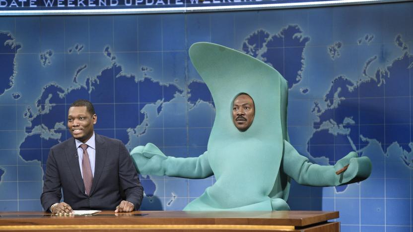 SATURDAY NIGHT LIVE -- "Eddie Murphy" Episode 1777 -- Pictured: (l-r) Michael Che, and host Eddie Murphy as Gumby during Weekend Update on Saturday, December 21, 2019 -- (Photo by: Will Heath/NBC/NBCU Photo Bank via Getty Images)
