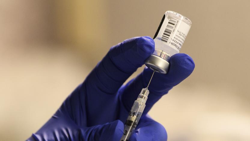 A pharmacist fills a syringe to prepare a dose of the Pfizer-BioNTech Covid-19 vaccine for front-line health care workers at a vaccination site at Torrance Memorial Medical Center on December 19, 2020 in Torrance, California. - The vaccine brings hope for health care workers as the Los Angeles County Department of Public Health reports over 600,000 positive COVID-19 cases in the county. (Photo by Patrick T. Fallon / AFP) (Photo by PATRICK T. FALLON/AFP via Getty Images)