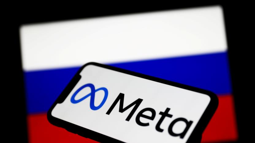 Meta logo displayed on a phone screen and Russian flag displayed on a screen in the background are seen in this illustration photo taken in Krakow, Poland on March 1, 2022. (Photo Illustration by Jakub Porzycki/NurPhoto via Getty Images)