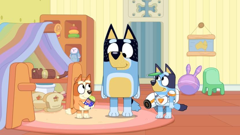 Image from the Bluey episode 'Surprise' where Bingo, Bandit and Bluey are standing in the playroom.