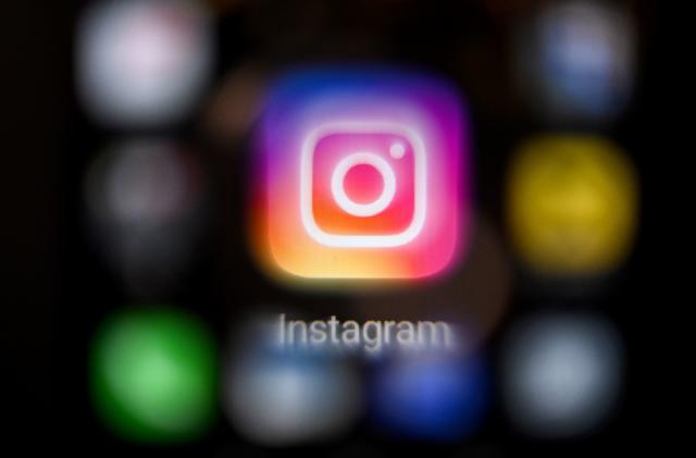A photo taken on March 14, 2022, shows the US social network Instagram logo on a smartphone screen in Moscow. - Instagram was inaccessible in Russia on March 14 after Moscow accused its parent company Meta of allowing calls for violence against Russians, including the military, on its platforms. (Photo by AFP) (Photo by -/AFP via Getty Images)