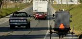 An Amish horse-drawn buggy makes its way on Route 340 near Bird-in-Hand, Pa. (Getty Images)