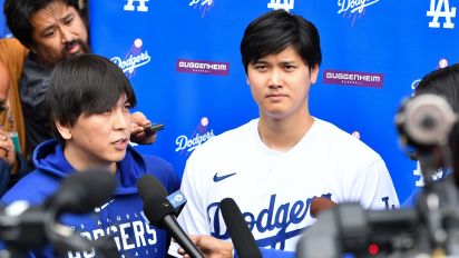 Getty Images - LOS ANGELES, CA - FEBRUARY 03: Los Angeles Dodgers designated hitter Shohei Ohtani (17) is interviewed  and his interpreter Ippei Mizuhara looks on during DodgerFest at Dodger Stadium on February 03, 2024 in Los Angeles, California. (Photo by Brian Rothmuller/Icon Sportswire via Getty Images)