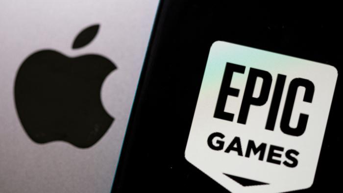 FILE PHOTO: Smartphone with Epic Games logo is seen in front of Apple logo in this illustration taken, May 2, 2021. REUTERS/Dado Ruvic/Illustration/File Photo