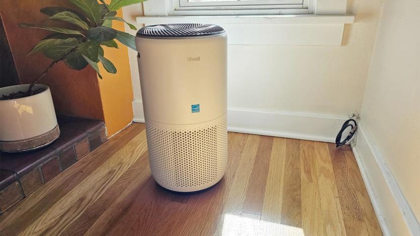 The Levoit Core 400S air purifier in white pictured on a wood floor