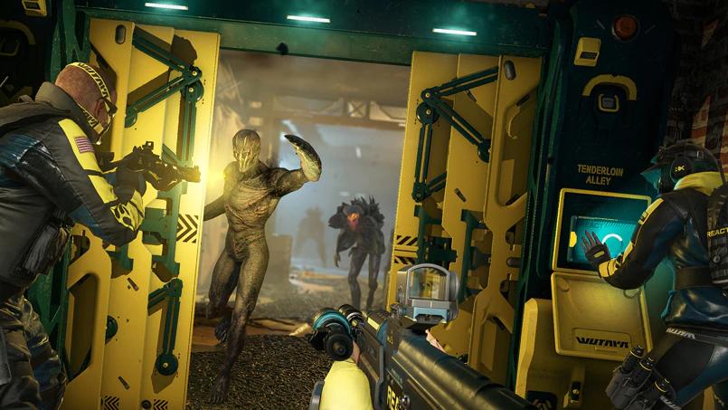 A screenshot from Rainbow Six Extraction, showing the player and a teammate aiming at aliens while a third teammate uses an access panel.