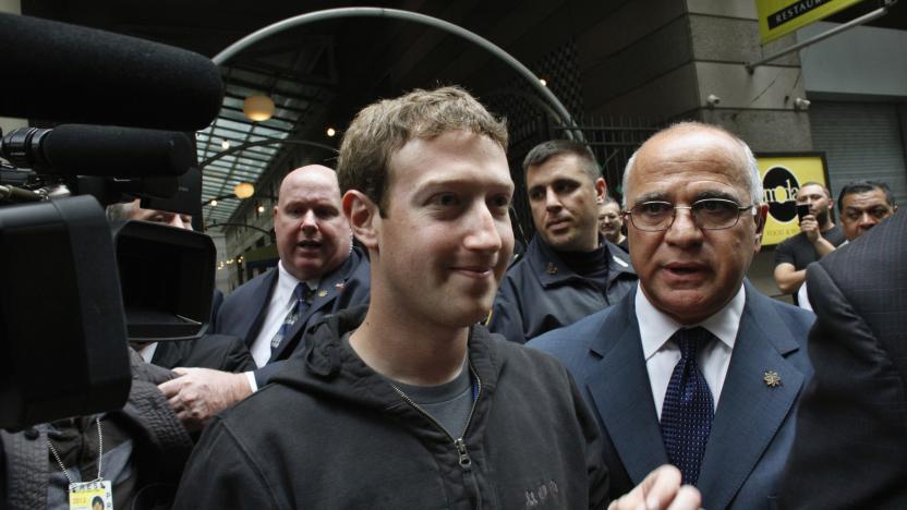 Facebook Inc. CEO Mark Zuckerberg is escorted by security guards as he departs New York City's Sheraton Hotel May 7, 2012. Facebook Inc kicked off its IPO roadshow in New York on Monday, attracting hundreds of investors to the Sheraton as the world's largest social network aims to raise about $10.6 billion, dwarfing the coming-out parties of tech companies like Google Inc and granting it a market value close to Amazon.com Inc's.   REUTERS/Eduardo Munoz    (UNITED STATES - Tags: BUSINESS SCIENCE TECHNOLOGY)