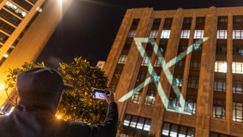 Twitter's new logo is seen projected on the corporate headquarters building in downtown San Francisco, California, U.S. July 23, 2023. REUTERS/Carlos Barria