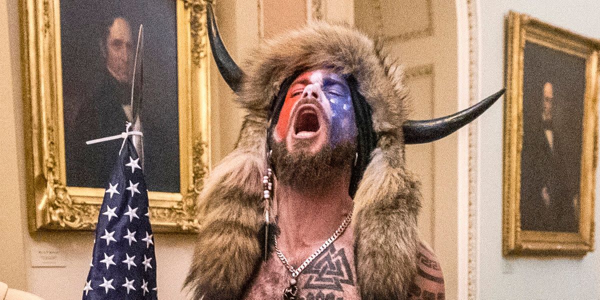 'QAnon Shaman' Jacob Chansley, A Capitol Riot 'Flag-Bearer,' Sentenced To Prison