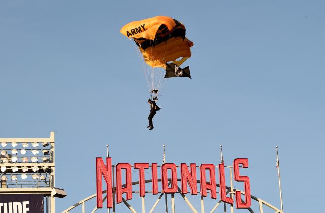 WASHINGTON, DC - APRIL 20: A member of the US Army Parachute Team The Golden Knights lands at Nationals Park before the game between the Washington Nationals and the Arizona Diamondbacks on April 20, 2022 in Washington, DC. (Photo by Greg Fiume/Getty Images)