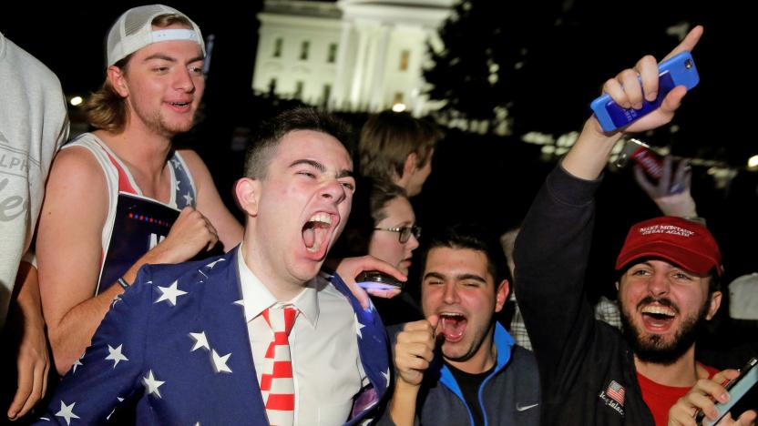 far-right protestors celebrating in front of the white house at night.