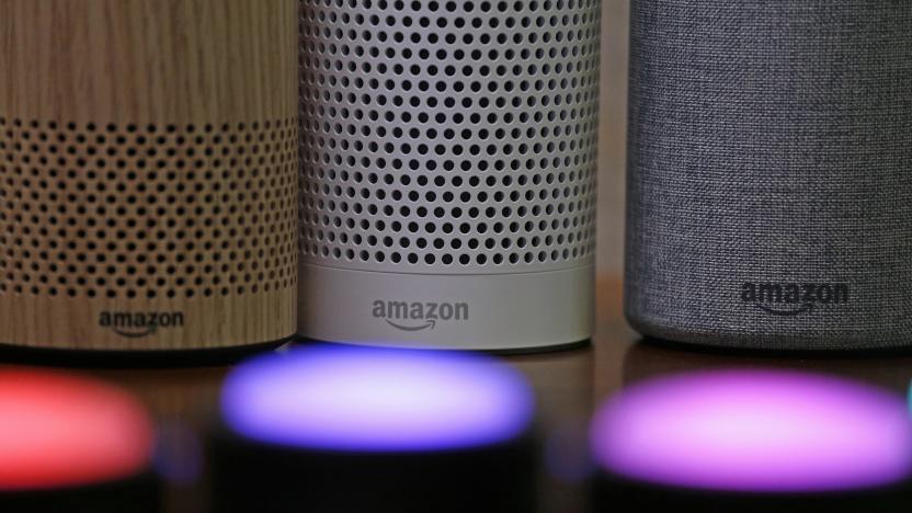 FILE - In this Sept. 27, 2017, file photo, Amazon Echo and Echo Plus devices, behind, sit near illuminated Echo Button devices during an event announcing several new Amazon products by the company in Seattle. Users of Amazon's Alexa digital assistant can now request that recordings of their voice commands delete automatically. (AP Photo/Elaine Thompson, File)