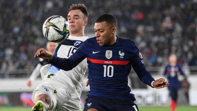 Finland's defender Leo Vaisanen (L) and France's forward Kylian Mbappe vie for the ball during the FIFA World Cup Qatar 2022 qualification Group D football match between Finland and France at the Olympic Stadium in Helsinki, on November 16, 2021. (Photo by FRANCK FIFE / AFP) (Photo by FRANCK FIFE/AFP via Getty Images)