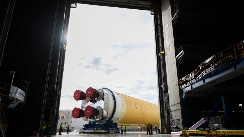 This NASA photo released on January 6, 2020 shows NASAs powerful new rocket, the Space Launch System (SLS), which will send astronauts a quarter million miles from Earth to lunar orbit at the Michoud Assembly Facility in New Orleans, Louisiana. - The agency is committed to landing American astronauts, including the first woman and the next man, on the Moon by 2024. Through the agencys Artemis lunar exploration program, we will use innovative new technologies and systems to explore more of the Moon than ever before.On January 1, 2020, NASA Administrator Jim Bridenstine tweeted: "Making progress! The massive @NASA_SLS core stage is moving to Building 110 at the Michoud Assembly Facility in Louisiana. There it will be readied for the Pegasus barge and its trip to @NASAStennis. Thank you to the @NASA team for working through the holidays!" (Photo by Jude Guidry / NASA / AFP) (Photo by JUDE GUIDRY/NASA/AFP via Getty Images)