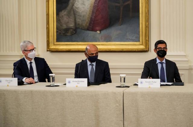 WASHINGTON, DC - AUGUST 25: (L-R) Apple CEO Tim Cook, IBM CEO Arvind Krishna and Google CEO Sundar Pichai listen as U.S. President Joe Biden speaks during a meeting about cybersecurity in the East Room of the White House on August 25, 2021 in Washington, DC. Members of the Biden cabinet, national security team and leaders from the private sector attended the meeting about improving the nation's cybersecurity.   Drew Angerer/Getty Images/AFP / AFP / GETTY IMAGES NORTH AMERICA / Drew Angerer