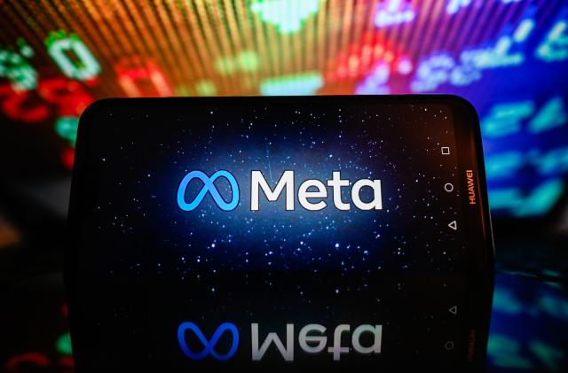 POLAND - 2023/11/23: In this photo illustration, a Meta logo is displayed on a smartphone with stock market percentages in the background. (Photo Illustration by Omar Marques/SOPA Images/LightRocket via Getty Images)