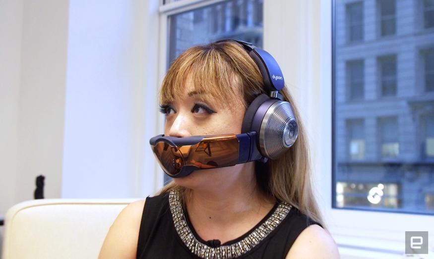 A woman wearing the Dyson Zone headphone and air filter combo unit.