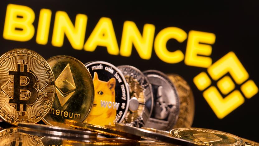 Representations of cryptocurrencies Bitcoin, Ethereum, DogeCoin, Ripple, and Litecoin are seen in front of a displayed Binance logo in this illustration taken, June 28, 2021. REUTERS/Dado Ruvic/Illustration