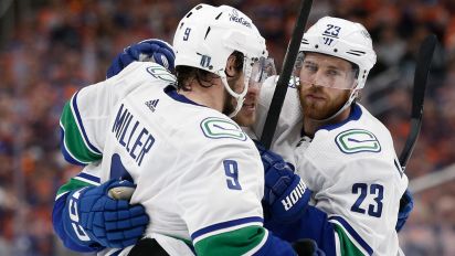 Getty Images - EDMONTON, ALBERTA - MAY 12: Brock Boeser #6 of the Vancouver Canucks celebrates with teammates after a hat trick during the first period against the Edmonton Oilers in Game Three of the Second Round of the 2024 Stanley Cup Playoffs at Rogers Place on May 12, 2024 in Edmonton, Alberta. (Photo by Codie McLachlan/Getty Images)