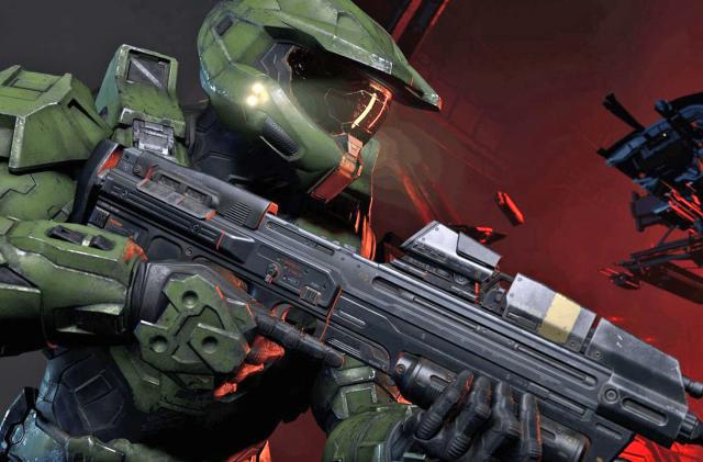 Closeup of Halo Infinite protagonist Master Chief carrying Halo's iconic Assualt Rifle.