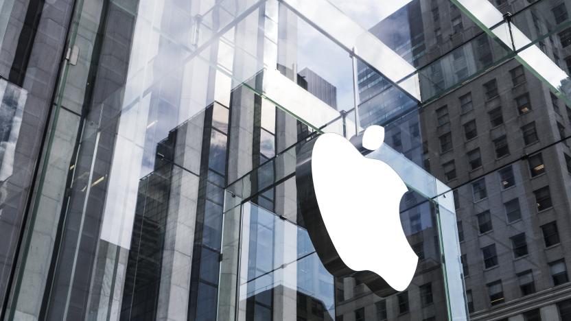 New York, United States - May 19, 2016: Glass building of the Apple Store with huge Apple Logo at 5th Avenue near Central Park. The store is designed as the exterior glass box above the underground display room