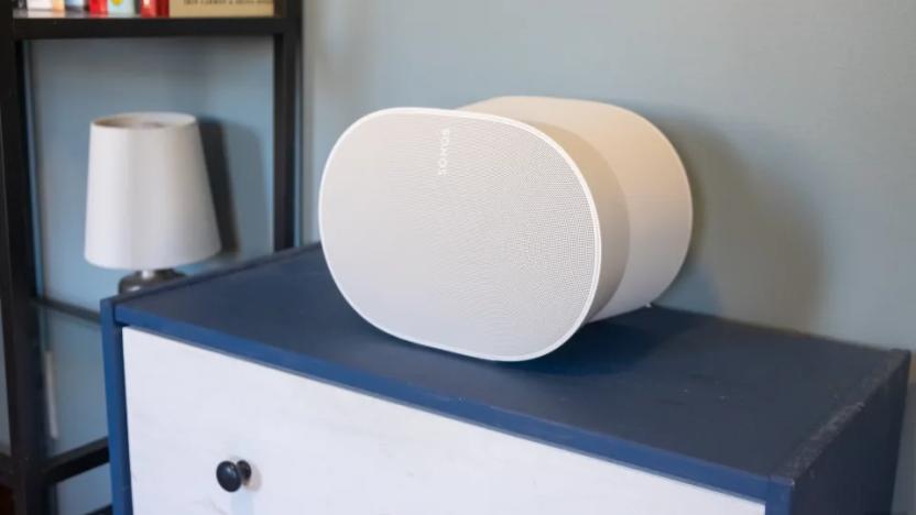 Photo of a white speaker on top of a blue cabinet.