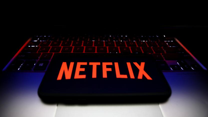 Netflix logo displayed on a phone screen and a laptop keyboard are seen in this illustration photo taken in Krakow, Poland on January 7, 2022. (Photo by Jakub Porzycki/NurPhoto via Getty Images)