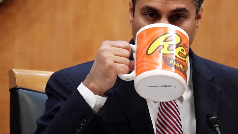 WASHINGTON, DC - DECEMBER 14:  Federal Communications Commission Chairman Ajit Pai drinks from a big coffee cup during a commission meeting December 14, 2017 in Washington, DC. The FCC is scheduled to vote on a proposal to repeal net-neutrality.  (Photo by Alex Wong/Getty Images)