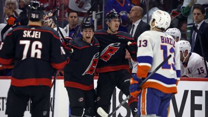 Associated Press - Carolina Hurricanes' Martin Necas, center right, celebrates after his empty-net goal with teammate Jack Drury, center left, and Brady Skjei (76) as New York Islanders' Mathew Barzal (13) skates by during the third period in Game 1 of an NHL hockey Stanley Cup first-round playoff series in Raleigh, N.C., Saturday, April 20, 2024. (AP Photo/Karl B DeBlaker)