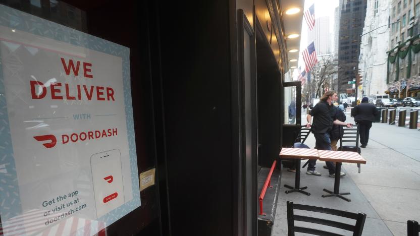 A DoorDash sign is pictured on a restaurant on the day they hold their IPO in the Manhattan borough of New York City, New York, U.S., December 9, 2020. REUTERS/Carlo Allegri