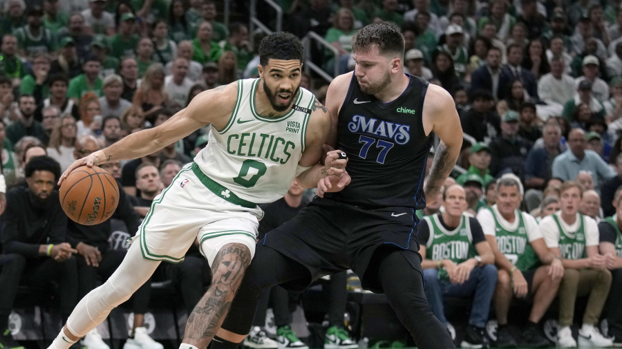 Associated Press - Boston Celtics forward Jayson Tatum (0) drives toward the basket as Dallas Mavericks guard Luka Doncic (77) defends during the first half of Game 1 of basketball's NBA Finals on Thursday, June 6, 2024, in Boston. (AP Photo/Charles Krupa)