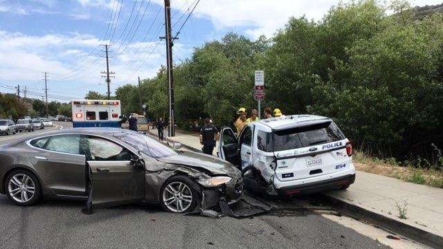 A Tesla sedan is shown after it struck a parked Laguna Beach Police Department vehicle in Laguna Beach, California, U.S. in this May 29, 2018 handout photo.  Laguna Beach Police Department/Handout via REUTERS  ATTENTION EDITORS - THIS IMAGE WAS PROVIDED BY A THIRD PARTY.  BEST QUALITY AVAILABLE.