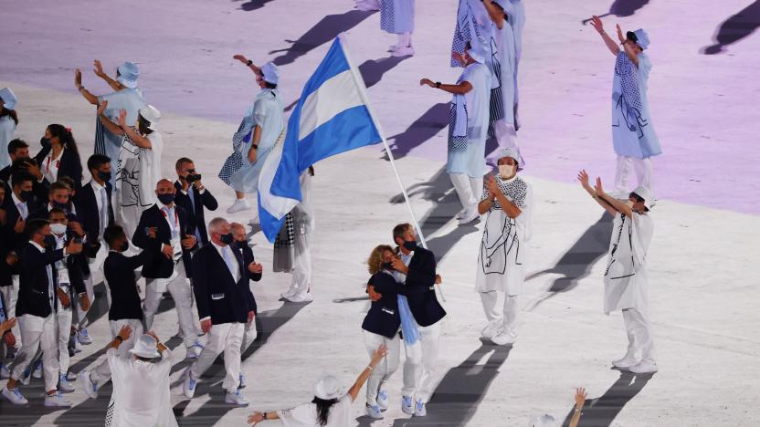 Tokyo 2020 Olympics - The Tokyo 2020 Olympics Opening Ceremony - Olympic Stadium, Tokyo, Japan - July 23, 2021.  Cecilia Carranza of Argentina and Santiago Lange of Argentina lead their contingent in the athletes parade during the opening ceremony REUTERS/Pilar Olivares