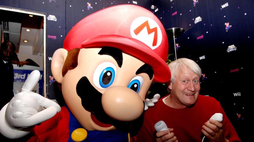 The voice of Super Mario, Charles Martinet, poses with mario at GAME Oxford Street, central London, on the evening that Super Mario Galaxy on the Nintendo Wii goes on sale in the UK.   (Photo by Stephen Kelly - PA Images/PA Images via Getty Images)