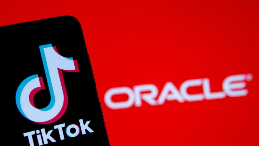 A smartphone with the Tik Tok logo is seen in front of a displayed Oracle logo in this illustration taken, Septemeber 14, 2020. REUTERS/Dado Ruvic/Illustration