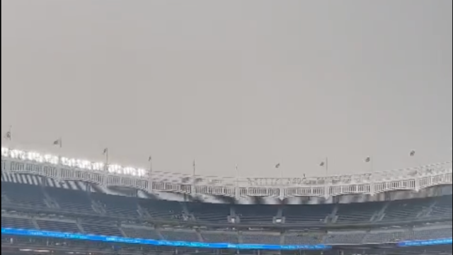 Fans at Yankee Stadium Watch Game in Haze of Smoke