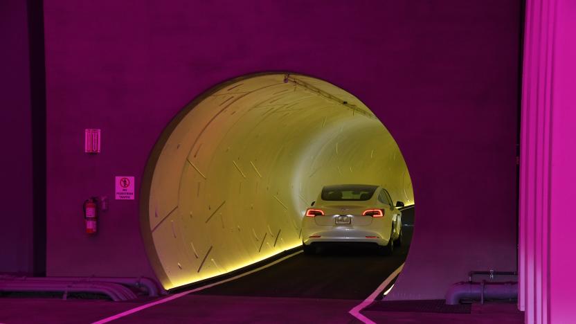 LAS VEGAS, NEVADA - APRIL 09:  A Tesla car drives through a tunnel in the Central Station during a media preview of the Las Vegas Convention Center Loop on April 9, 2021 in Las Vegas, Nevada. The Las Vegas Convention Center Loop is an underground transportation system that is the first commercial project by Elon Musk’s The Boring Company. The USD 52.5 million loop, which includes two one-way vehicle tunnels 40 feet beneath the ground and three passenger stations, will take convention attendees across the 200-acre convention campus for free in all-electric Tesla vehicles in under two minutes. To walk that distance can take upward of 25 minutes. The system is designed to carry 4,400 people per hour using a fleet of 62 vehicles at maximum capacity. It is scheduled to be fully operational in June when the facility plans to host its first large-scale convention since the COVID-19 shutdown. There are plans to expand the system throughout the resort corridor in the future.  (Photo by Ethan Miller/Getty Images)