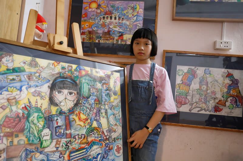 A Vietnamese school girl draws paintings about the coronavirus disease (COVID-19) in Hanoi