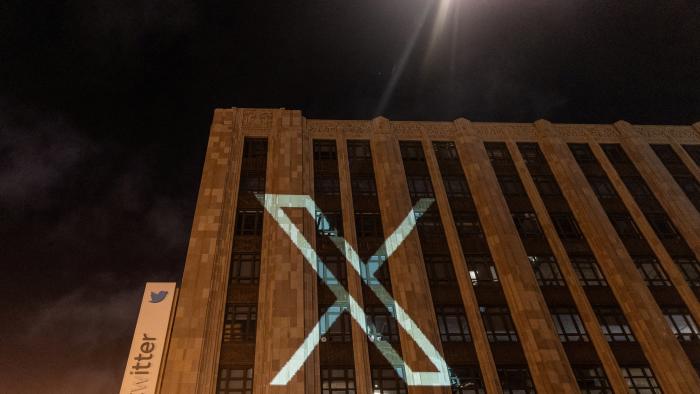 Twitter's new logo is seen projected on the corporate headquarters building in downtown San Francisco, California, U.S. July 23, 2023. REUTERS/Carlos Barria