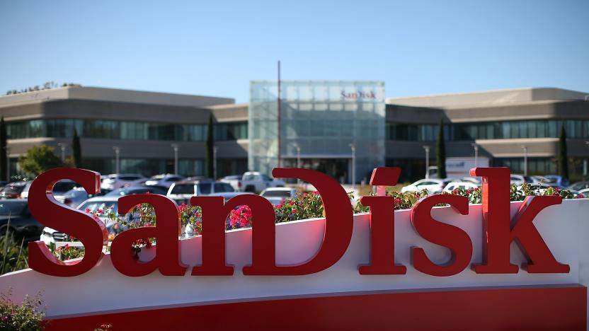 MILPITAS, CA - OCTOBER 21:  A sign is posted in front of the SanDisk headquarters on October 21, 2015 in Milpitas, California. Computer data storage company Western Digital announced plans to acquire flash memory storage maker SanDisk for $19 billion.  (Photo by Justin Sullivan/Getty Images)