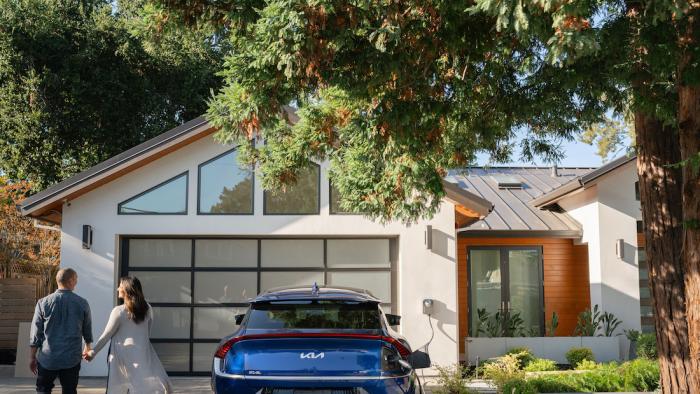 A house with an EV charger in front. 