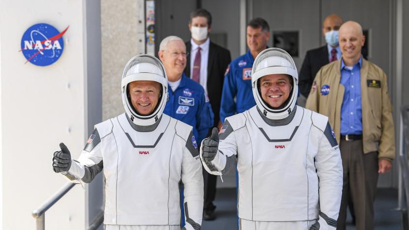 KENNEDY SPACE CENTER, FL - MAY 30:  NASA commercial crew astronauts Doug Hurley (L) and Bob Behnken walk out on their way to launch from historic Launch Complex 39A aboard the SpaceX Falcon 9 rocket in the crew Dragon capsule bound for the International Space Station.  (Photo by Jonathan Newton/The Washington Post via Getty Images)