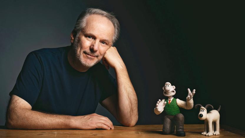 Nick Park, creator and director of ‘Wallace & Gromit’ poses next to figurines of the main two characters.