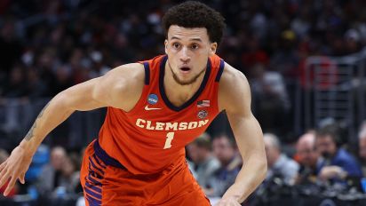 Getty Images - LOS ANGELES, CALIFORNIA - MARCH 28: Chase Hunter #1 of the Clemson Tigers drives against Jaden Bradley #0 of the Arizona Wildcats during the second half in the Sweet 16 round of the NCAA Men's Basketball Tournament at Crypto.com Arena on March 28, 2024 in Los Angeles, California. (Photo by Harry How/Getty Images)