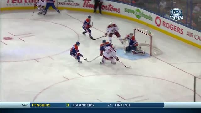 Radim Vrbata flips a one-timer past Dubnyk