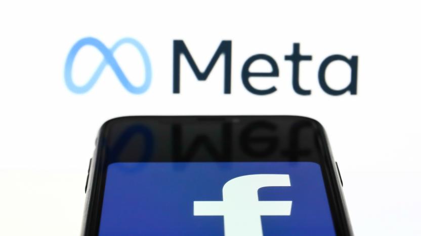 Meta logo displayed on a laptop screen and Facebook app logo displayed on a phone screen are seen in this illustration photo taken in Krakow, Poland on October 28, 2021. Mark Zuckerberg announced during Facebook Connect event that the new name of Facebook company will be Meta (Photo by Jakub Porzycki/NurPhoto via Getty Images)